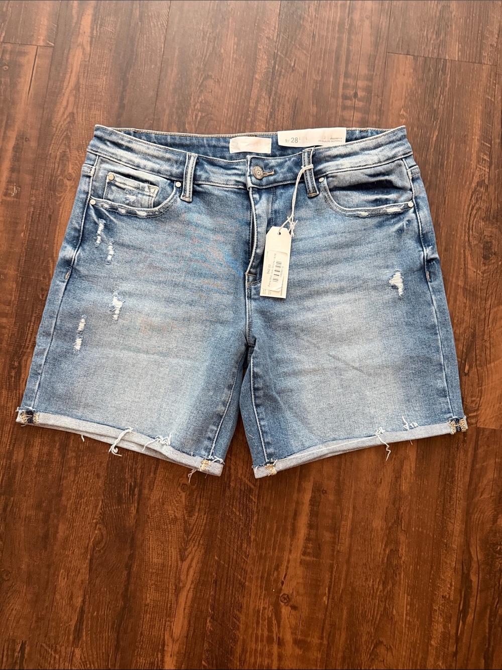 Women’s Mid Wash Distressed Denim Shorts with Raw Hem